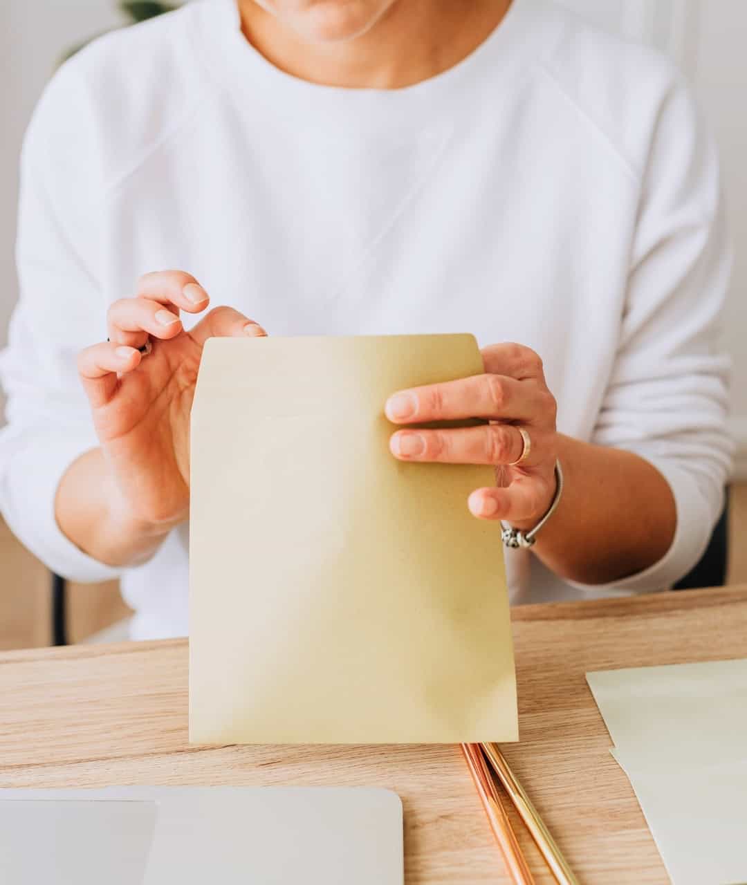 Person holding Lyme disease at-home test kit, close-up of hands and test paper.